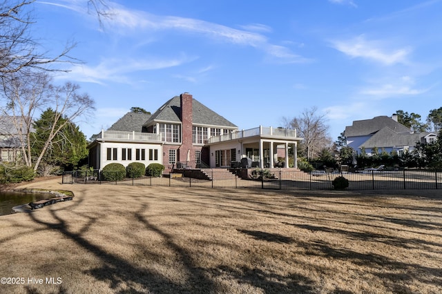 back of property with a balcony