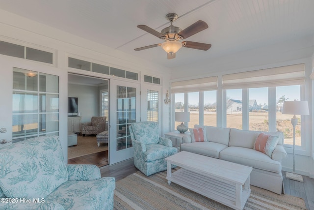 sunroom / solarium with ceiling fan