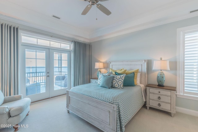 bedroom featuring crown molding, french doors, light carpet, and access to outside