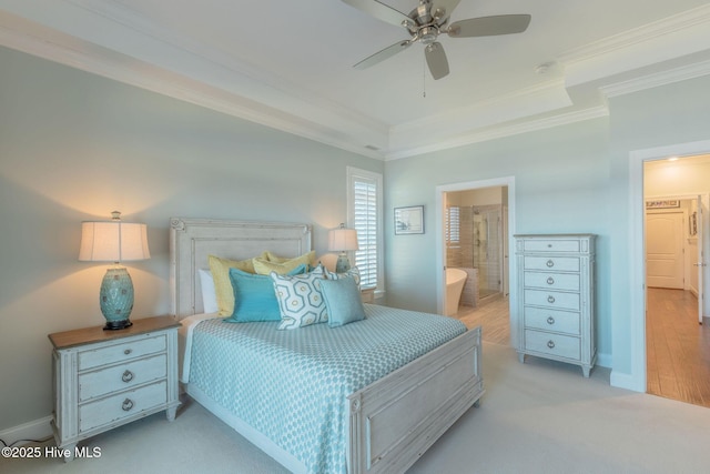 carpeted bedroom with ornamental molding, ceiling fan, and ensuite bathroom