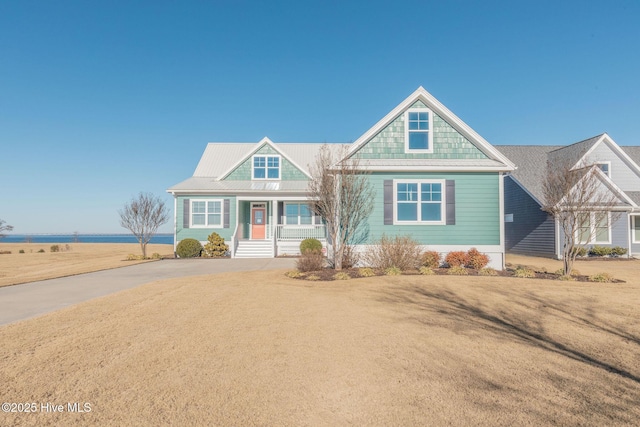 view of front facade featuring a front lawn and covered porch