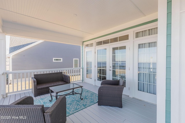 deck featuring an outdoor living space and french doors