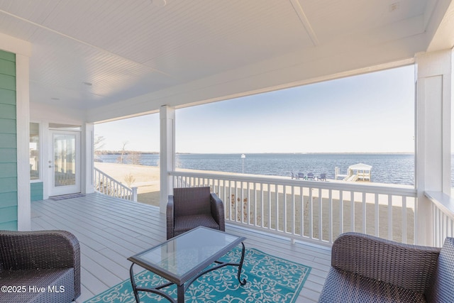 wooden deck with a water view