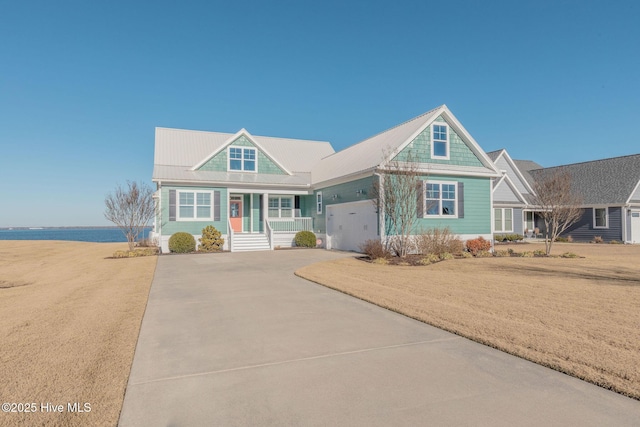 view of front of house with a garage and a front lawn