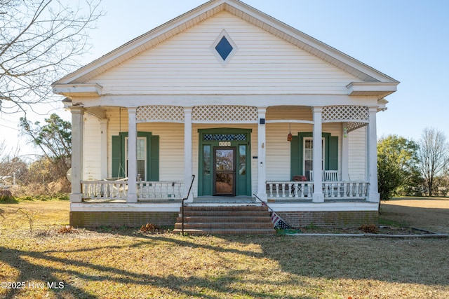 view of front of house featuring a porch and a front yard