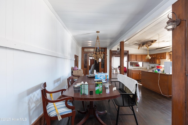 dining room featuring a chandelier and dark hardwood / wood-style floors