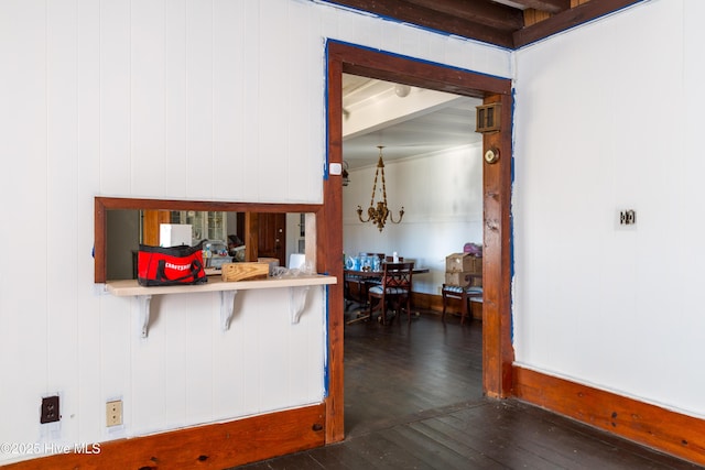 kitchen with a breakfast bar and dark hardwood / wood-style flooring