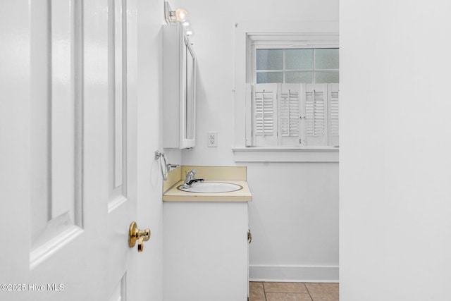 bathroom with vanity and tile patterned floors