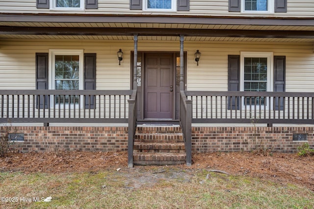 doorway to property with covered porch