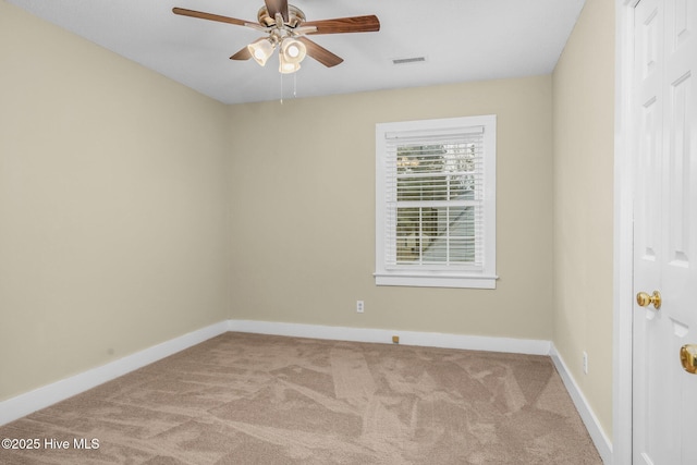 unfurnished room featuring ceiling fan and light colored carpet