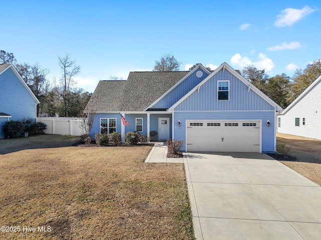 view of front facade with a front lawn and a garage