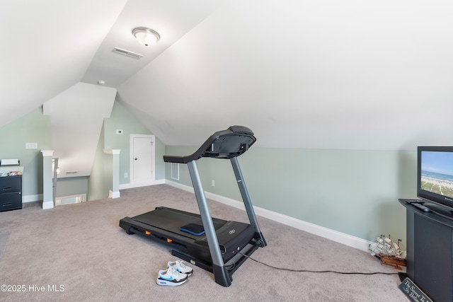 workout room with carpet and lofted ceiling