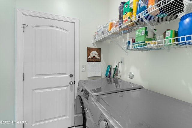 clothes washing area featuring washing machine and dryer