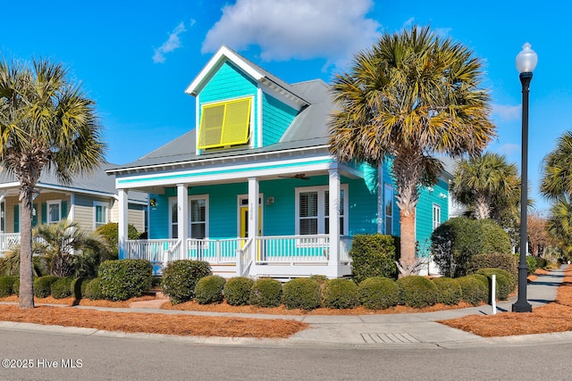 view of front of home featuring covered porch and metal roof