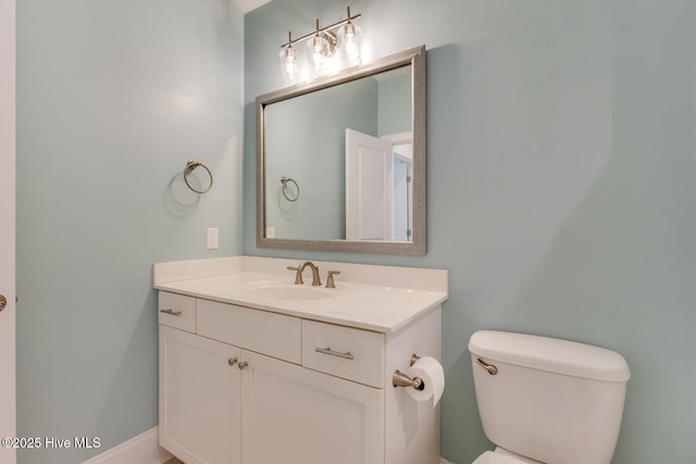 bathroom featuring toilet and vanity