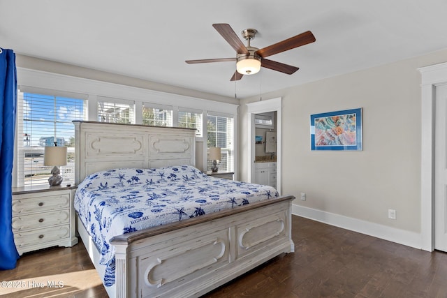 bedroom featuring ceiling fan, dark hardwood / wood-style flooring, and connected bathroom