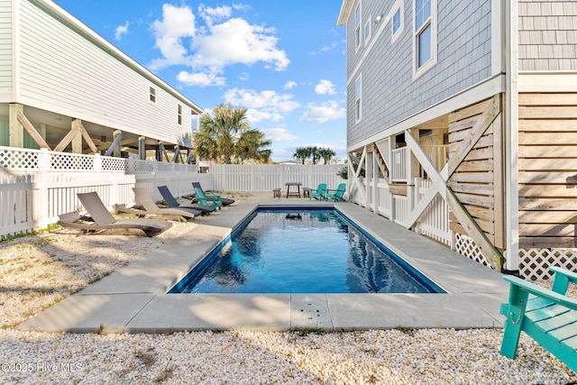 view of swimming pool with a patio