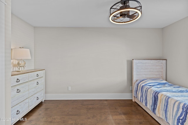 bedroom featuring dark hardwood / wood-style flooring