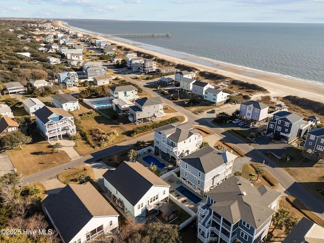 aerial view featuring a water view and a beach view