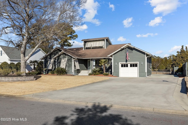 view of front of home with a garage and covered porch