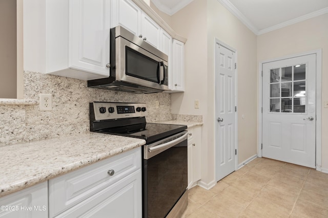 kitchen with white cabinets, decorative backsplash, light stone countertops, crown molding, and appliances with stainless steel finishes