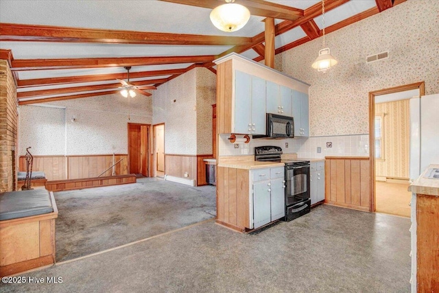 kitchen with decorative light fixtures, black appliances, high vaulted ceiling, beam ceiling, and ceiling fan