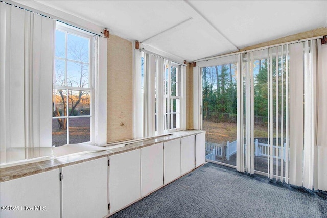 unfurnished sunroom featuring a healthy amount of sunlight