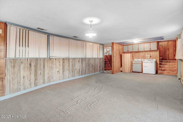 102 Circle Dr, Snow Hill, NC 28580 - interior space with washing machine and clothes dryer, visible vents, and wooden walls