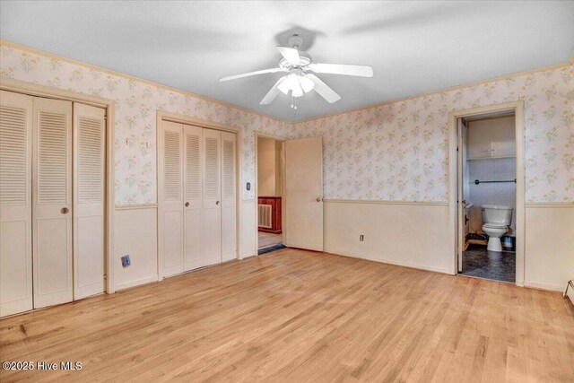 carpeted empty room featuring a baseboard radiator and crown molding