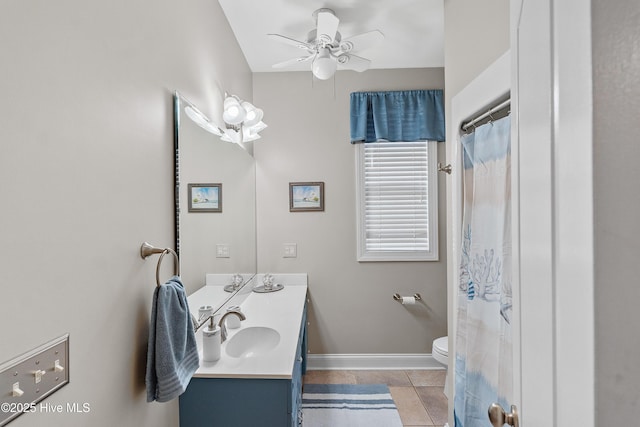 bathroom featuring ceiling fan, tile patterned floors, vanity, and toilet