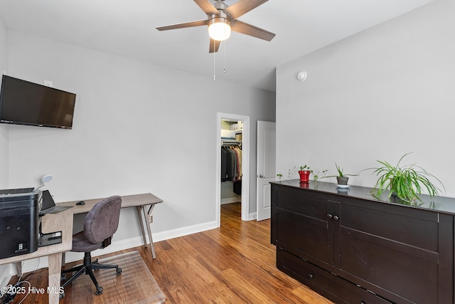 office space with ceiling fan and light hardwood / wood-style floors