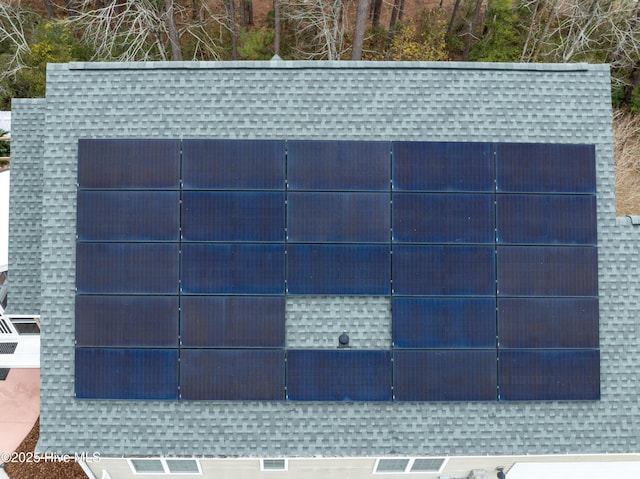 view of gate with solar panels