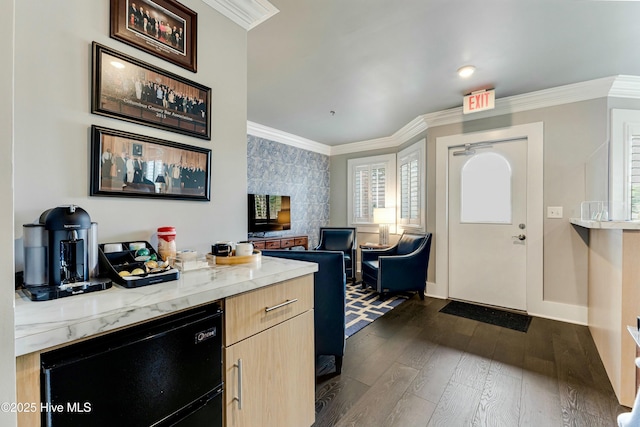 kitchen with light brown cabinets, dark hardwood / wood-style flooring, and crown molding