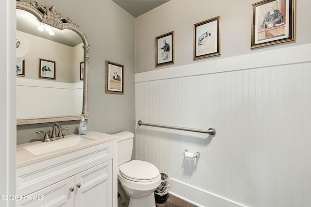 bathroom with toilet and vanity