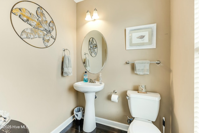 bathroom featuring toilet and sink