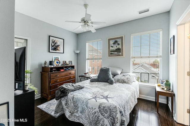 bedroom featuring ceiling fan and dark hardwood / wood-style floors