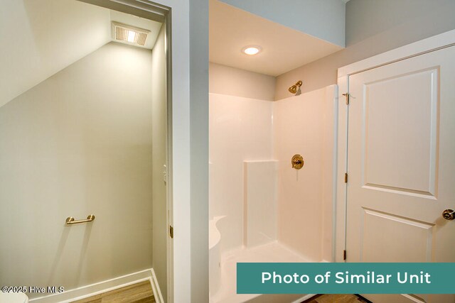 bathroom featuring visible vents and walk in shower