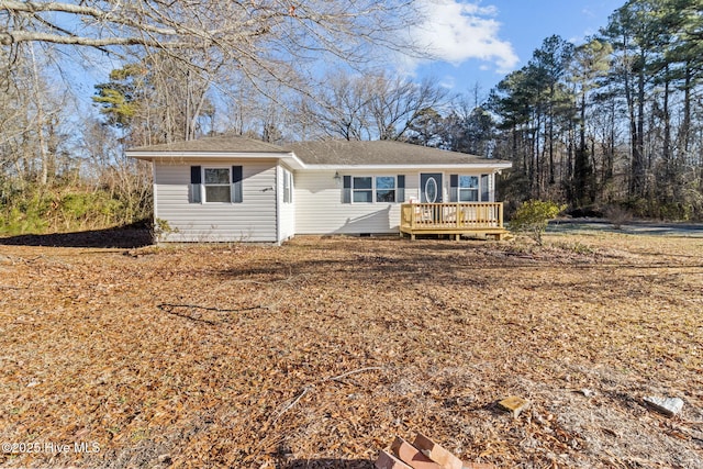 ranch-style house featuring a wooden deck