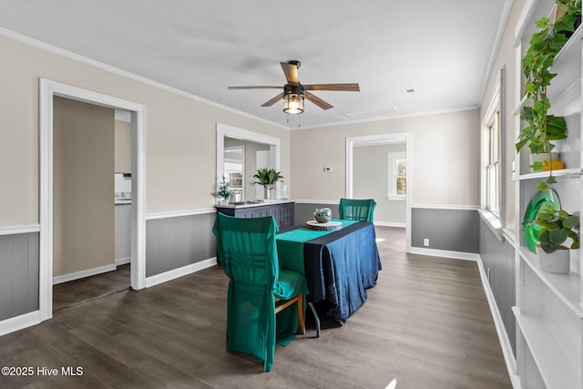 interior space with ornamental molding, ceiling fan, and dark hardwood / wood-style floors