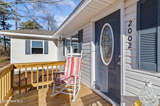 doorway to property featuring a deck