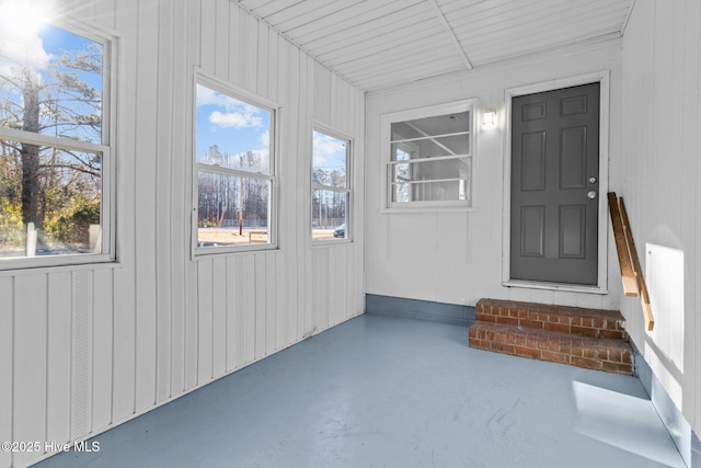 unfurnished sunroom featuring a wealth of natural light