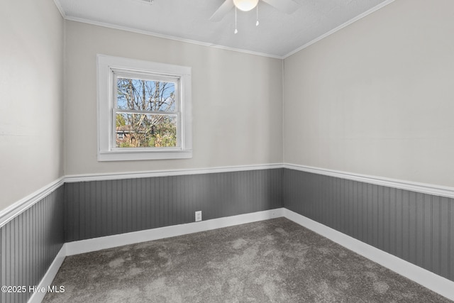 unfurnished room with carpet flooring, ceiling fan, and ornamental molding