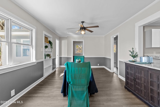 dining space featuring ornamental molding, ceiling fan, and dark wood-type flooring