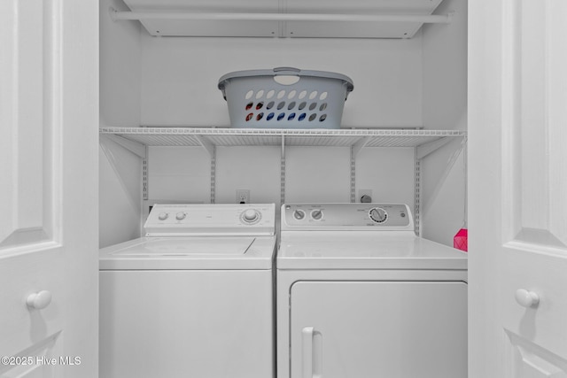 washroom with independent washer and dryer