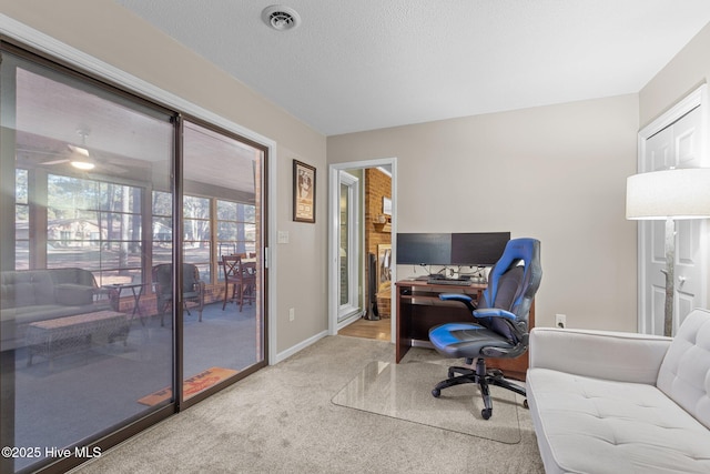 office area featuring carpet and a textured ceiling