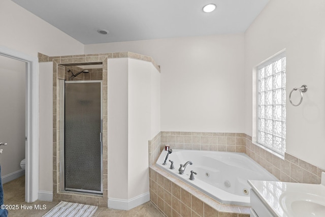 full bathroom with toilet, shower with separate bathtub, tile patterned floors, and vanity