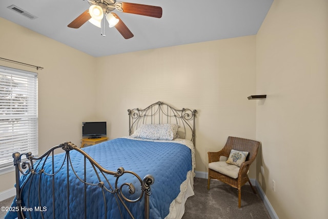 bedroom featuring dark carpet and ceiling fan