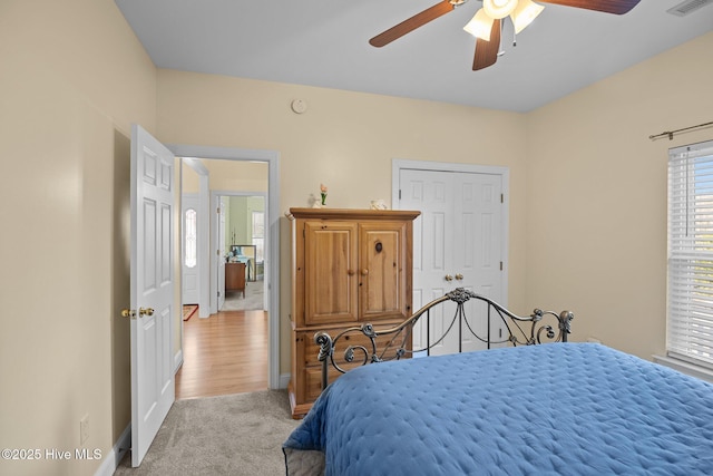 carpeted bedroom featuring ceiling fan