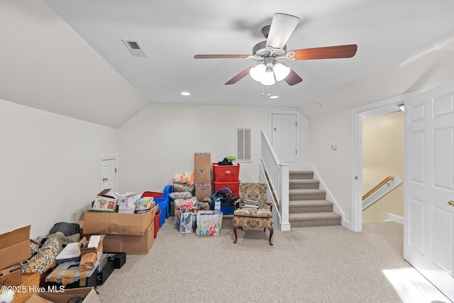 rec room featuring lofted ceiling, light colored carpet, and ceiling fan