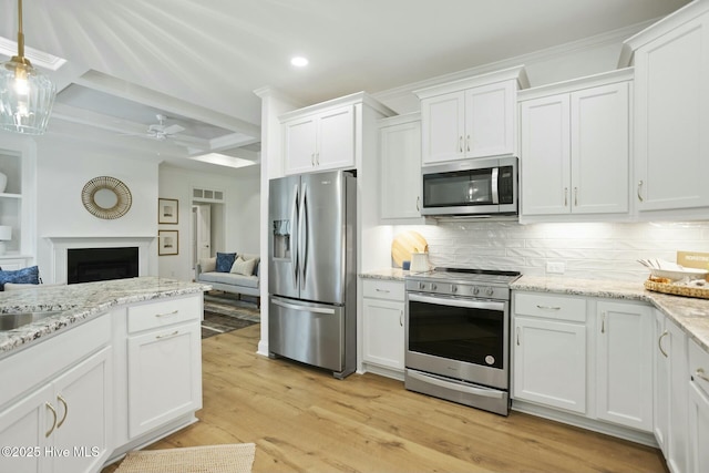 kitchen featuring coffered ceiling, backsplash, white cabinetry, appliances with stainless steel finishes, and beamed ceiling